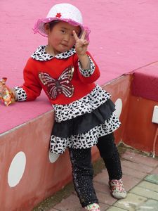 My little friend turns away from the dancers to say good bye from Qinghai Lake.