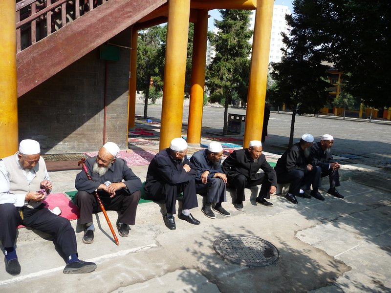 Groups of men can be seen in every part of the courtyard of the Great Mosque.