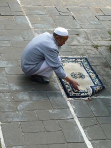 The prayer-rug is perfectly aligned