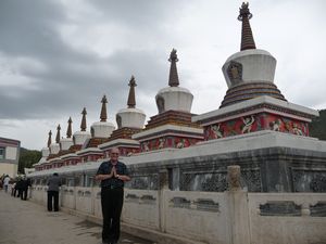 LET ME NOW TAKE YOU ON A PHOTO JOURNEY THROUGH ONE OF TIBETAN BUDDHISM'S MOST HOLY AND REVERED TEMPLES ... THE MAIN ENTRANCE IS NEAR THESE 8 STUPAS.