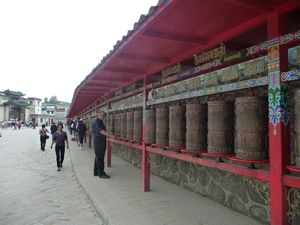 We must first pass along this path of Buddhist prayer-wheels.