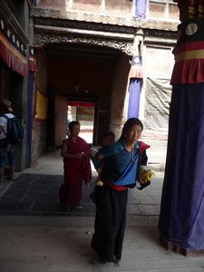 Tibetan Pilgrim walking the halls of the Ta'er Si.