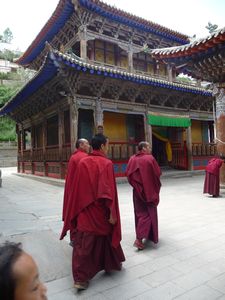 Buddhist monks make a visit to one of the shrines.