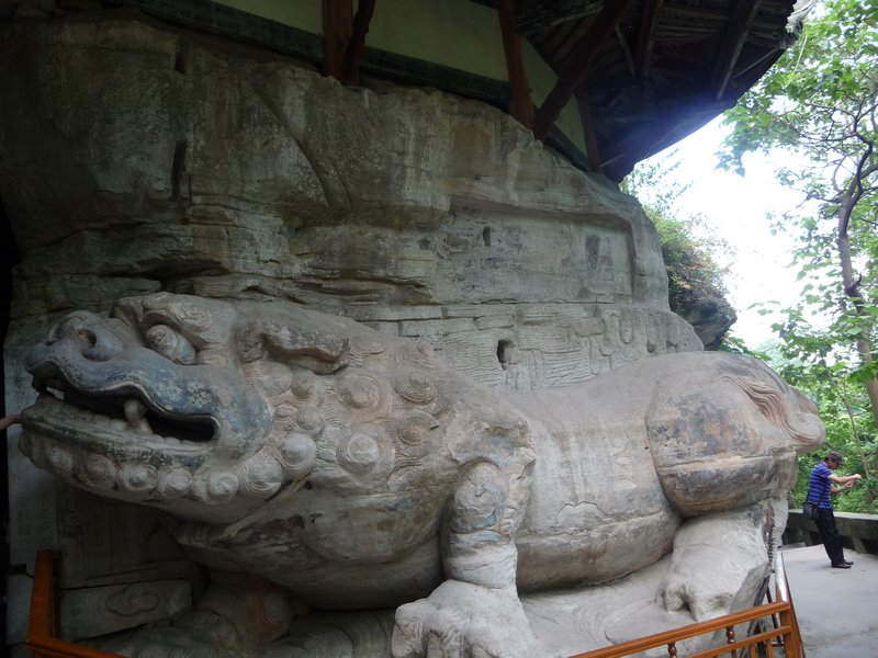 Stone Lion, twice life-sized, guards the entrance to the Cave of Full Enlightenment.