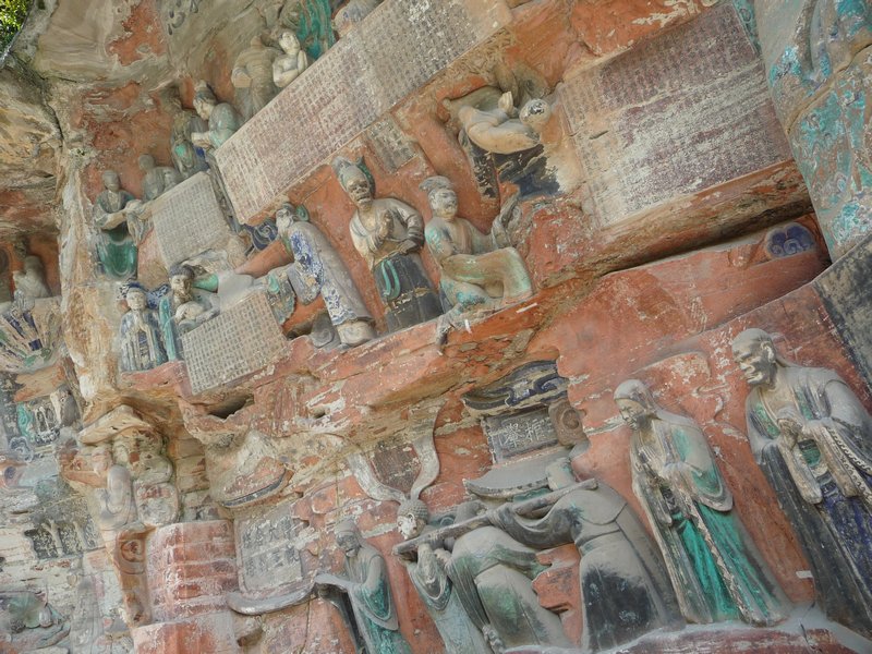 Among the 1,000s of figures are scrolls of Buddhist teachings and law.