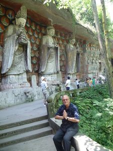 On the rock behind them are 81 little round shrines, each about 2 feet in diameter, with a small statue of Buddha inside.