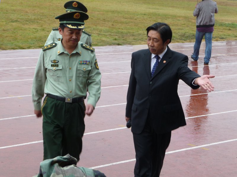 Mr. Xu returns to reviewing stand.