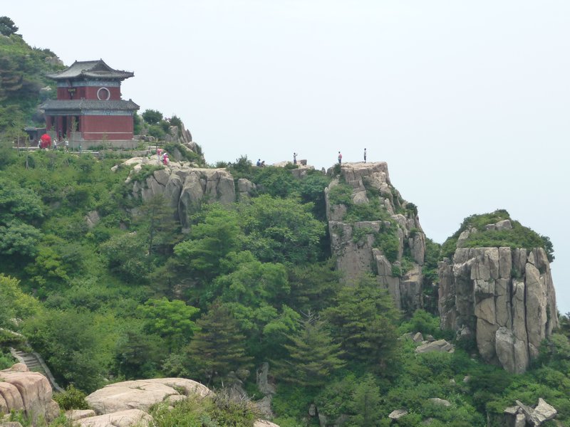 Daoist and Buddhist shrines hug Tai Mountain ridges.