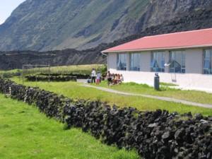 school yard and volcanic rock fence