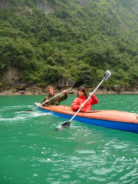 Kayaking through the cave of Halong Bay
