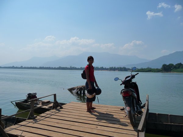 Michy waiting for the ferry to cross the mekong