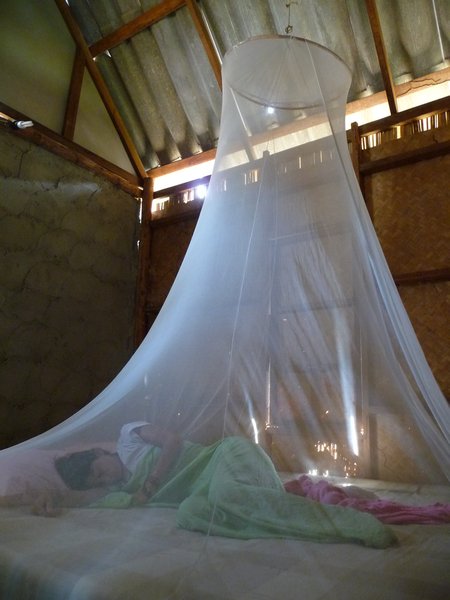 Morning angel under her mosquito net