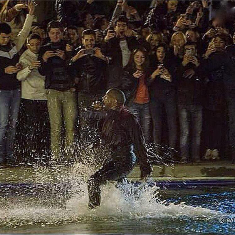 Kanye jumps in a lake