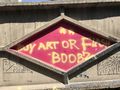 "Buy art or flash boobz" (Graffiti outside my hotel.)