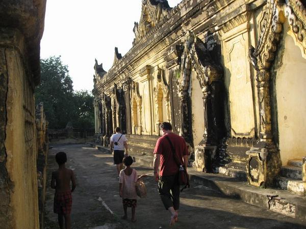 Traipsing around another ancient temple near Mandalay, trailed by begging kids.