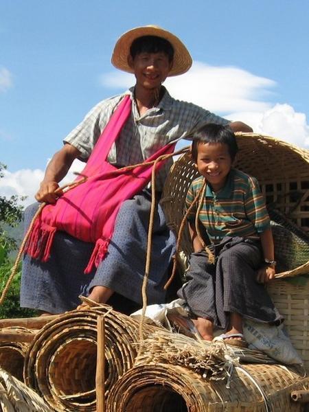 This little kid, up on the ox-cart with his old man, had just about the cheekiest grin I'd ever seen.