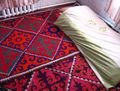 My bed in Aitbek's house, on lots of colourful 'shyrdaks' (felt rugs)