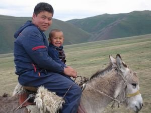 Islan & his little brother on a tiny donkey