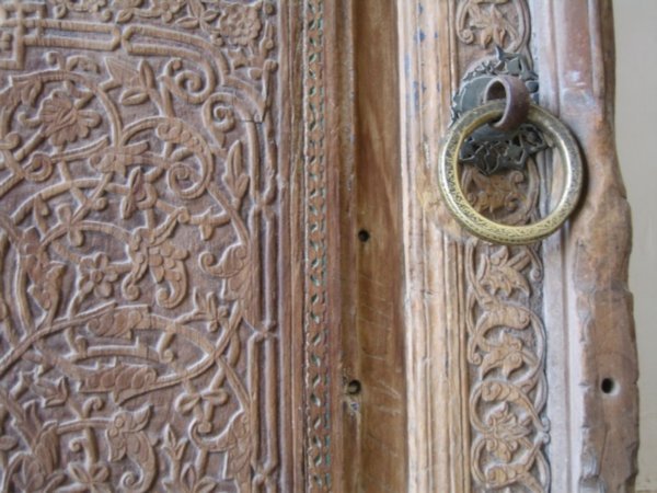 Carved door leading into the Tilla-Kari Medressa