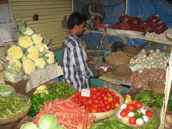 Buying vegetables (subzi) at a market stall