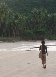 Jen walking along the Surat Thani beach