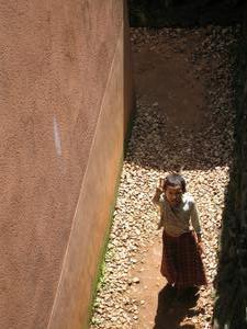 Little girl running through the passageway around the Terrace of the Leper King