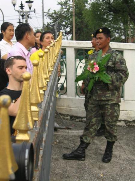 Soldier accepts flowers from the crowd