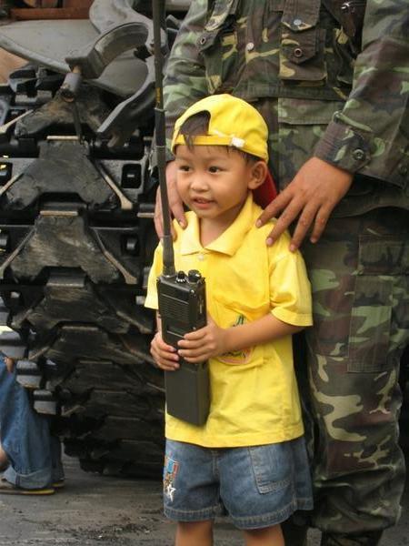 Little boy poses with a soldier