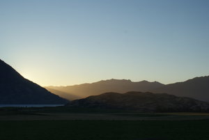 Sun coming through the hills on the way back to Queenstown
