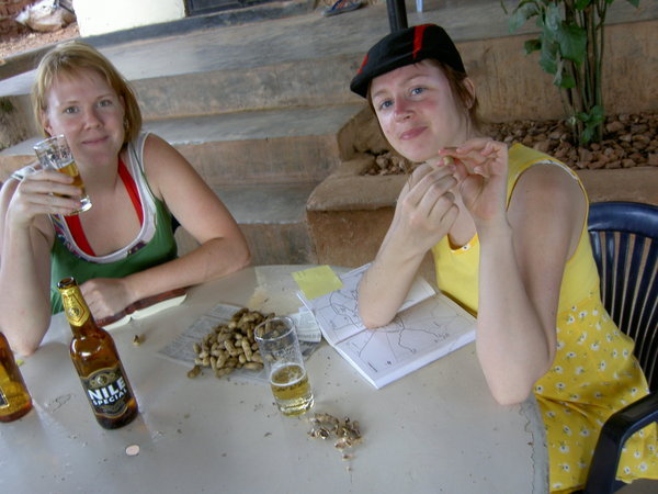 a nice ugandan beer  and some fresh ground nuts in the heat