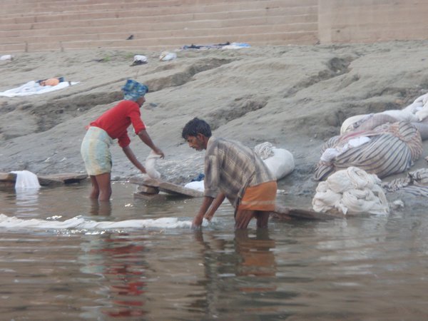Men washing sheets in the Ganges