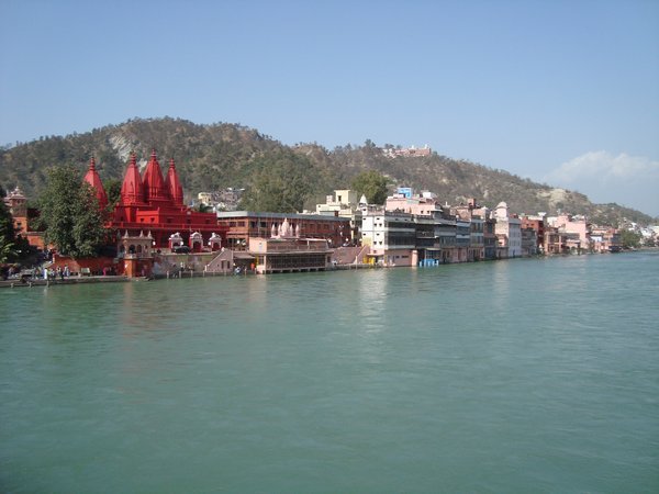 Red coloured ashram on The Ganges at Haridwar