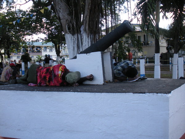 Energetic residents of Castries guarding the cannon