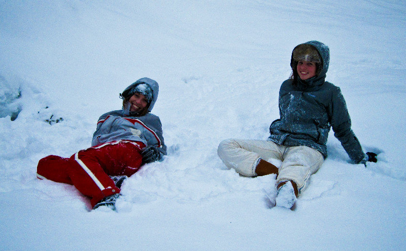 Allison and Christie resting after sledding