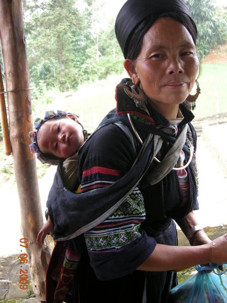 Black H'mong woman and her baby