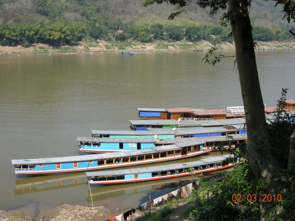 Slow boats along the banks of the Mekong