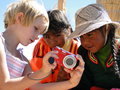Amy sharing some photos with girls from Uros Island