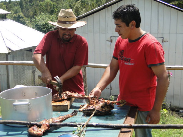 Cutting the meat at the Asado on Lemuy Island