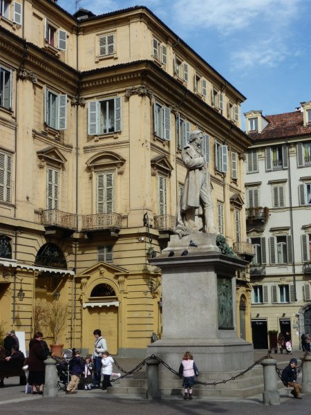 one of the many statues in a piazza in Torino