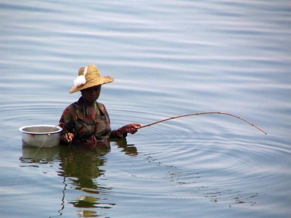 Wading fisherwoman