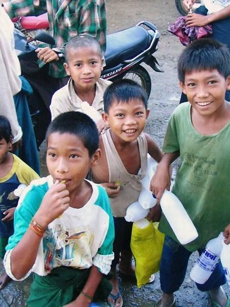 Kids collecting water bottles