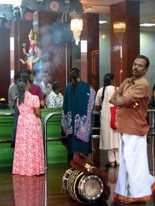 Drummer and celebrants in Sri Mahamariamman temple