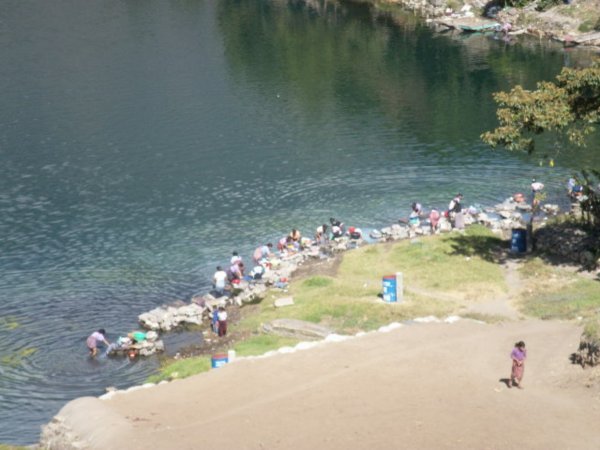 Santiago - woman doing laundry in lake