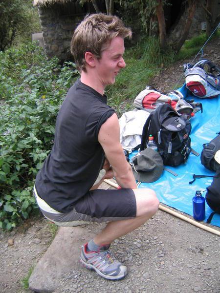Simon demonstrates the correct posture for a squat toilet