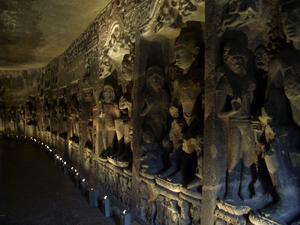 Buddhist sculptures along one of the Ajanta cave walls