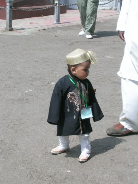 A little cutie joining in the Muslim celebrations.