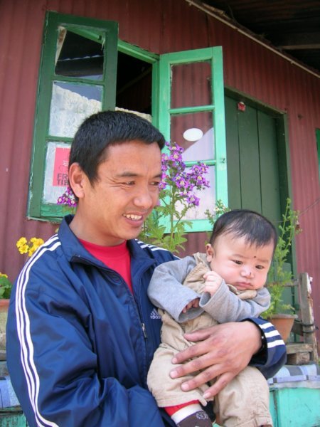 Baby and uncle at the Tibetan Refugee village.