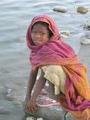 Such a pretty girl washing her hands in the Ganga.