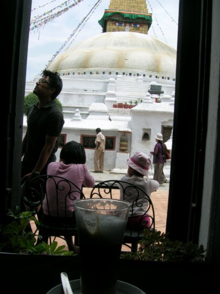 The worlds largest stupa in the background, a latte in the foreground.