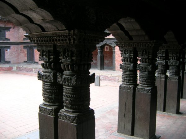Intricately carved wooden columns.